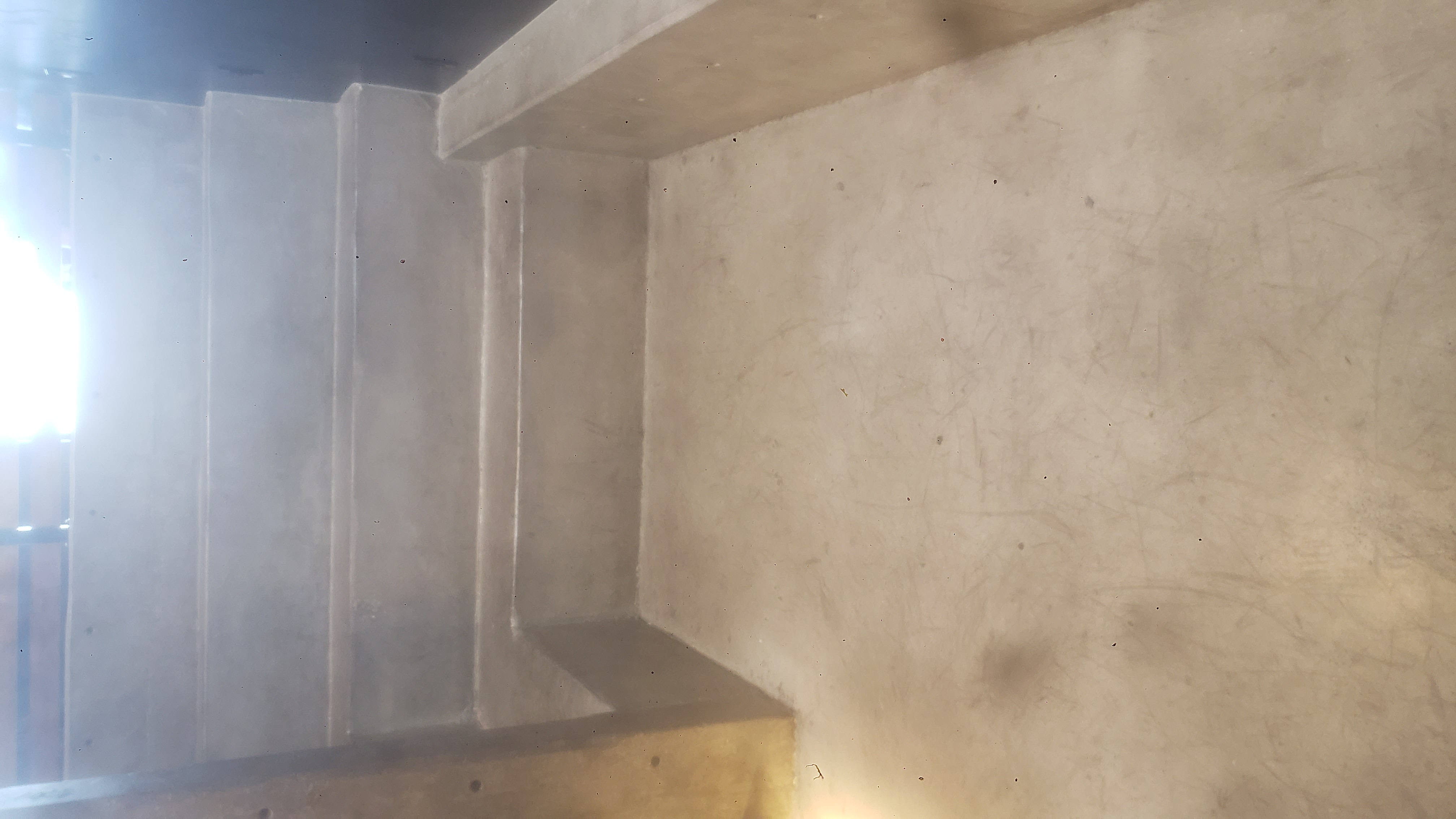 Sunken tiered platform for sitting at a coffee shop.